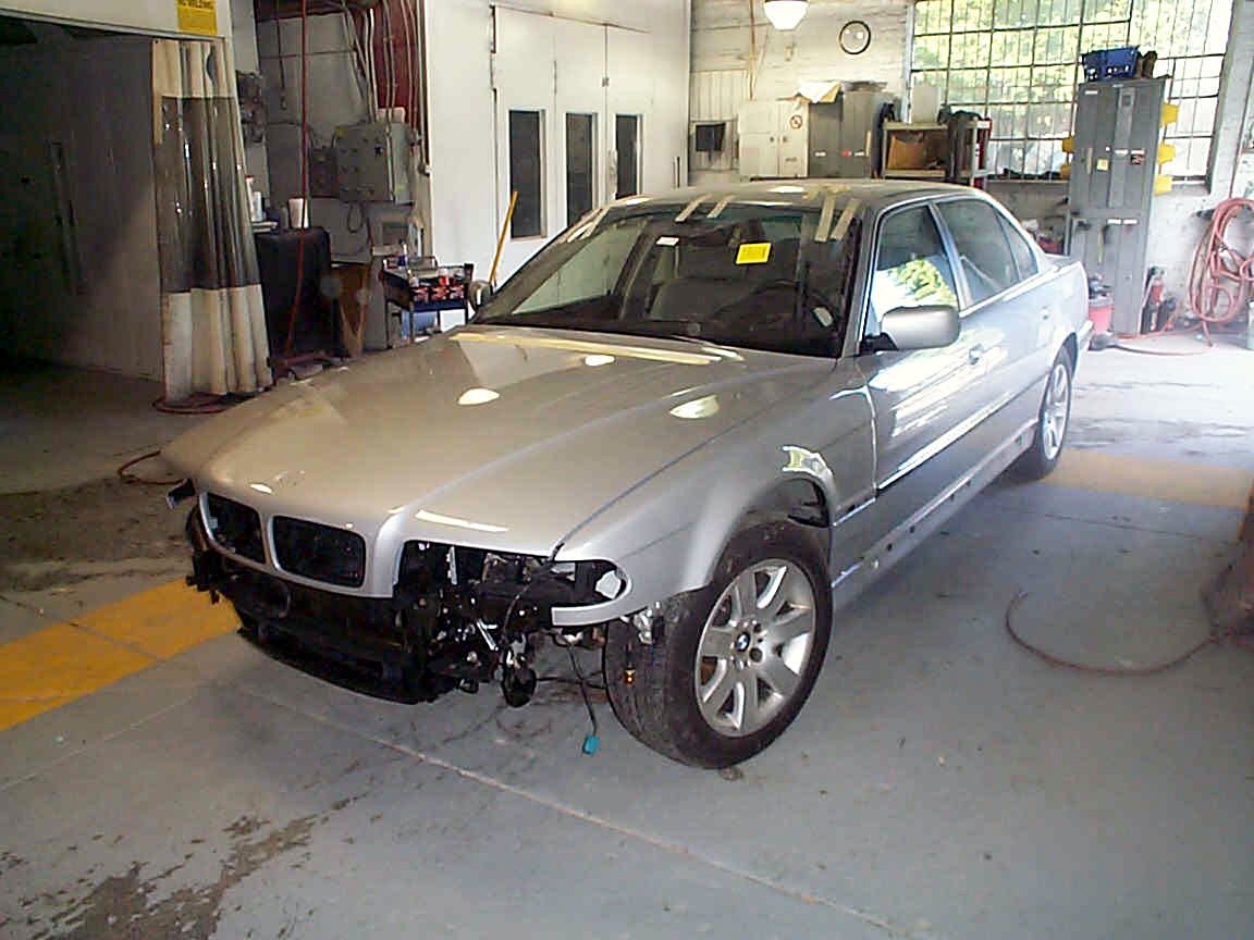 A BMW in our shop with new panels on, partway through reassembly